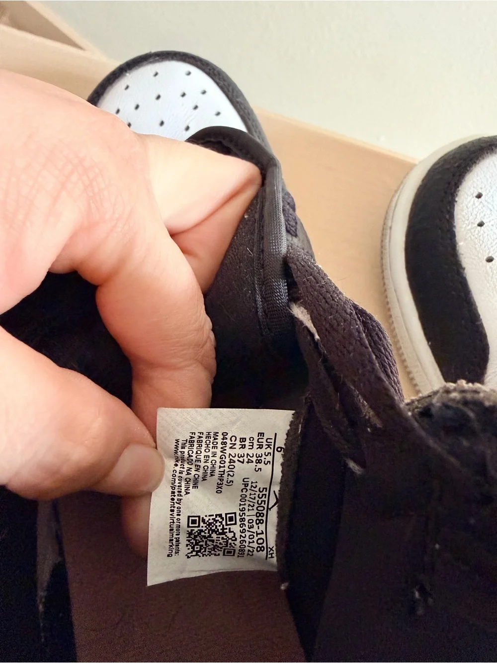 Nike Air Jordan 1 Black and White High-Top Sneakers with Pink Accent